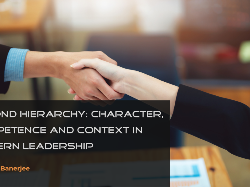 Two professionals shaking hands, symbolising trust, collaboration and partnership in leadership.